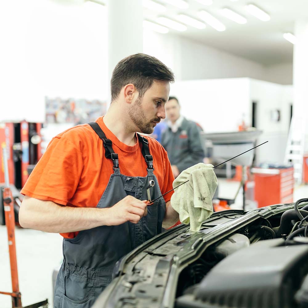 Car mechanic fixing a car