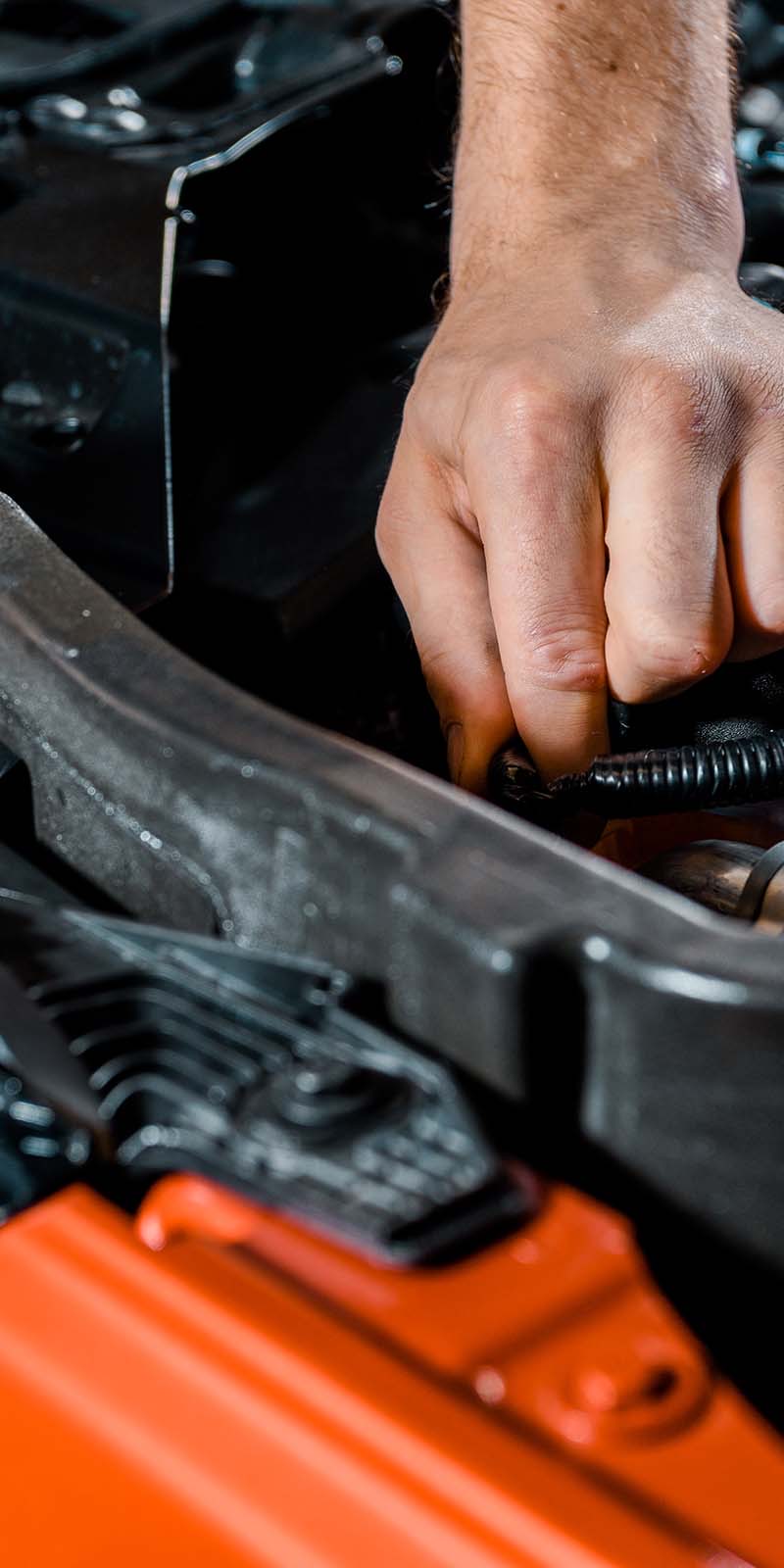 Auto mechanic checking an automobile
